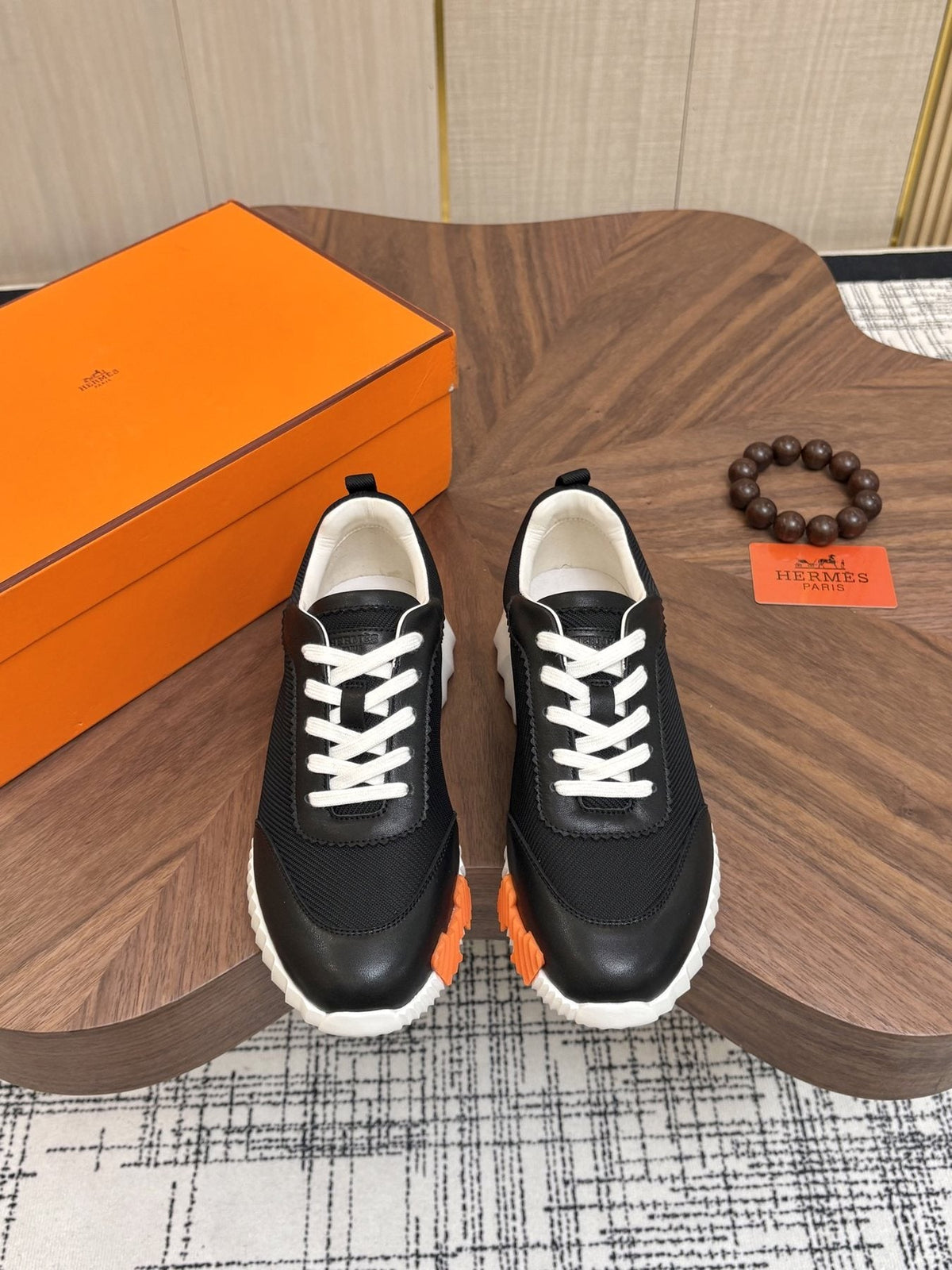 Hermes Black Ribbed Sole Sneakers — front