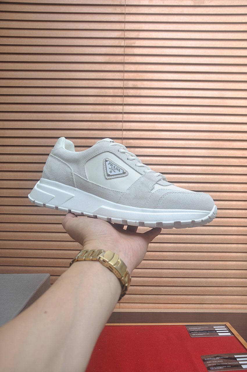 Prada Triangle Plaque Low-Top Sneakers — side