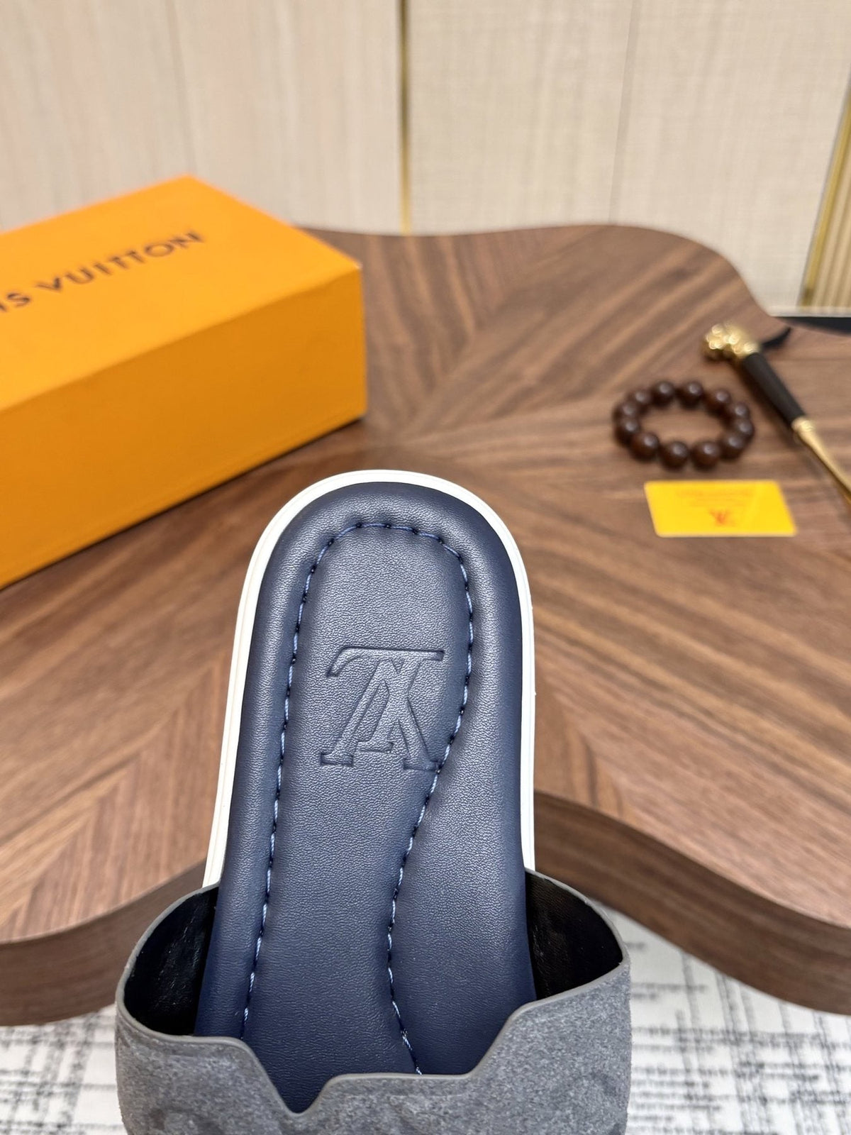 Louis Vuitton Embossed Navy Blue Slide Sandals — side